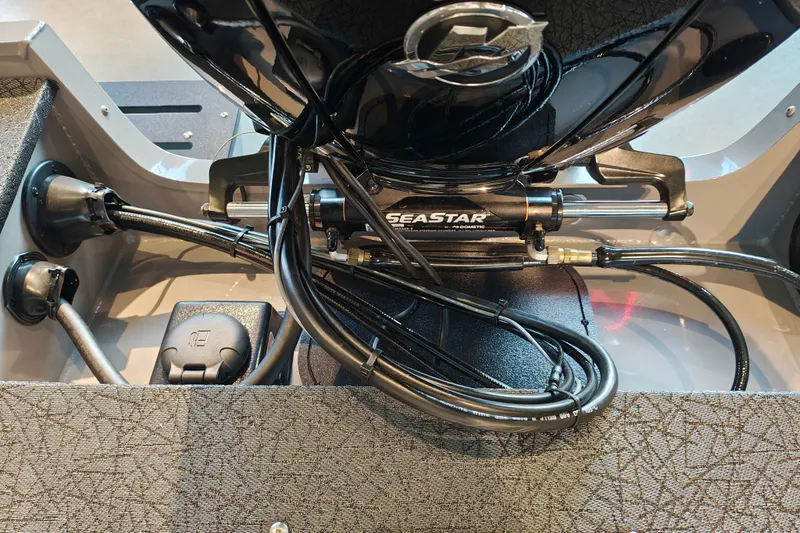 Slide: The Image of 2027 Tracker Targa V-18 WT boat steering system with SeaStar hydraulic components. - 38