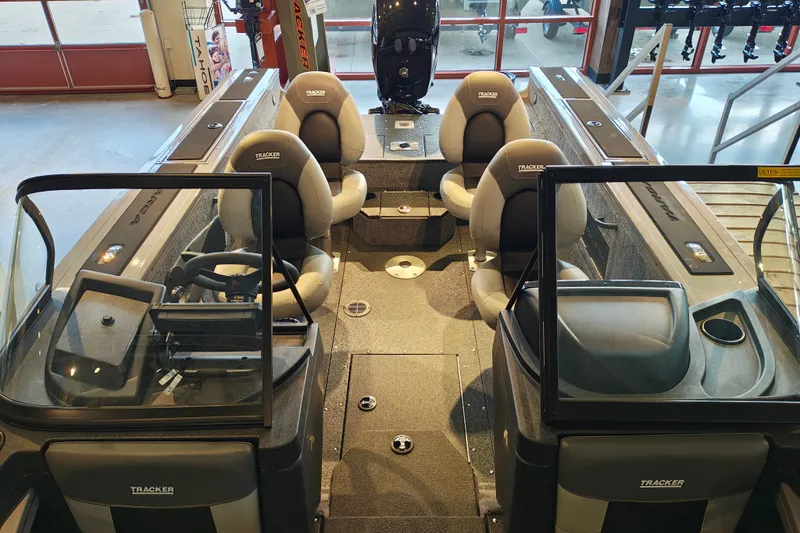 Slide: The Image of 2027 Tracker Targa V-18 WT boat interior with seating and steering console. - 28