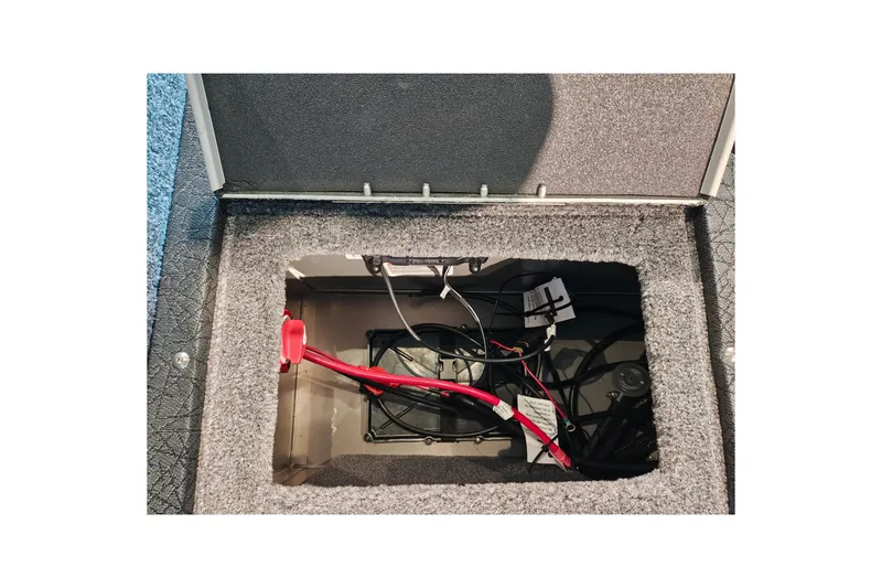 Slide: The Image of Open compartment in 2027 Tracker Targa V-18 WT boat showing wiring and components. - 37