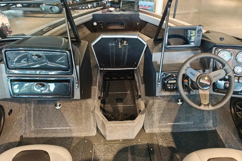 Slide: The Image of Interior of 2027 Tracker Targa V-18 WT boat with steering wheel and control panel. - 22