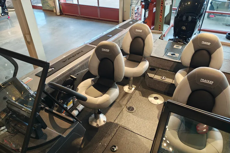 Slide: The Image of Interior of 2027 Tracker Targa V-18 WT boat with seating and steering console. - 31