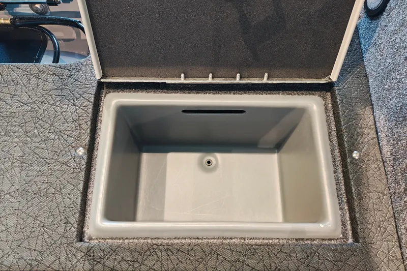 Slide: The Image of Open storage compartment in 2027 Tracker Targa V-18 WT boat. - 36
