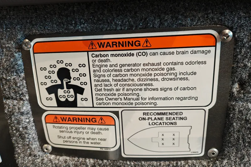 Slide: The Image of Warning label on 2027 Tracker Targa V-18 WT about carbon monoxide and propeller safety. - 17