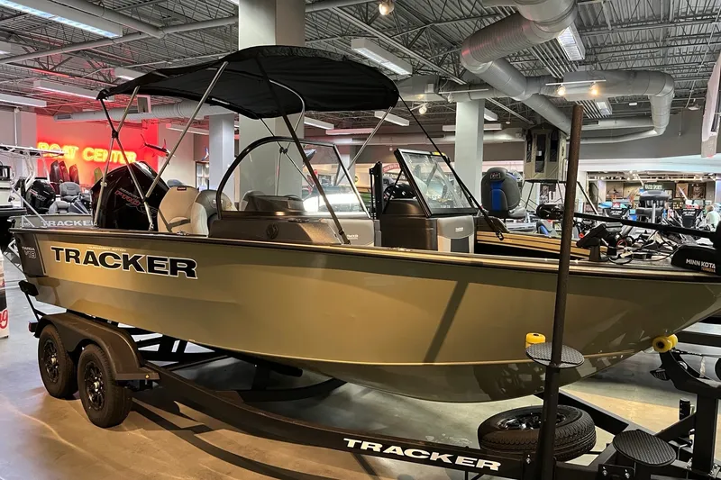 The Image of 2027 Tracker Targa V-18 WT boat displayed indoors on a trailer. - 0