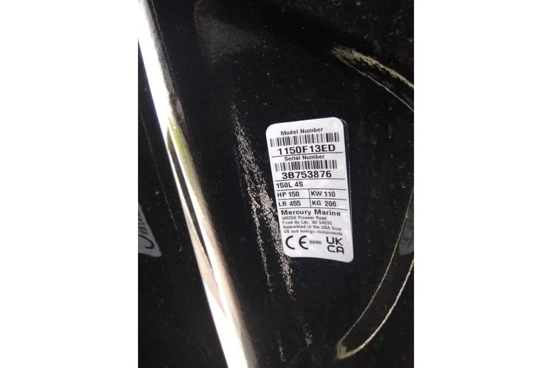 Slide: The Image of Label on Sun Tracker Party Barge 22 DLX, 2027 model, showing specifications and serial number. - 100