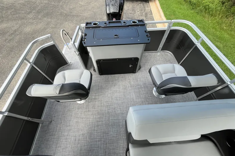 Slide: The Image of 2027 Sun Tracker SportFish 20 DLX pontoon boat interior with seating and control console. - 17