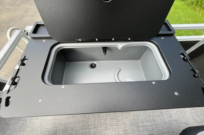 Slide: The Image of Livewell compartment on 2027 Sun Tracker SportFish 20 DLX boat, open lid view. - 20