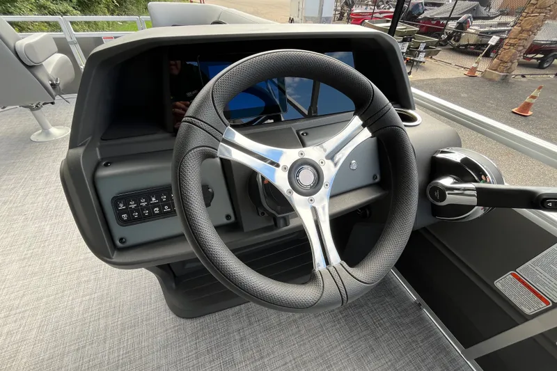 Slide: The Image of Steering console of 2027 Sun Tracker SportFish 20 DLX pontoon boat. - 16