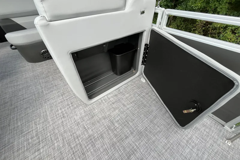 Slide: The Image of Interior storage compartment of 2027 Sun Tracker SportFish 20 DLX boat, featuring sleek design. - 14