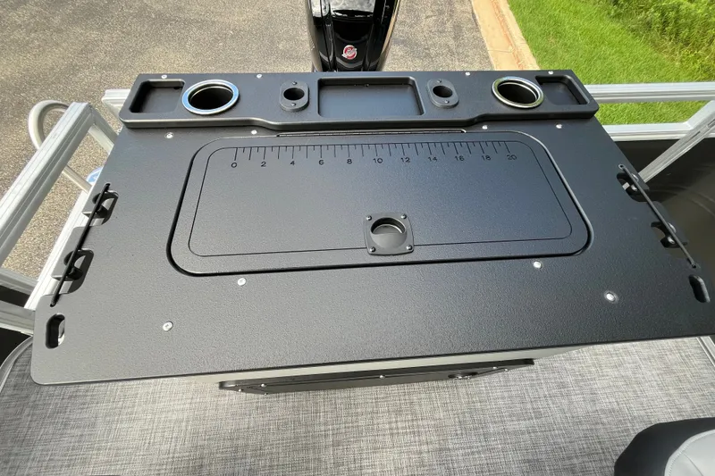 Slide: The Image of Sun Tracker SportFish 20 DLX 2027 fishing station with integrated measuring board and cup holders. - 18