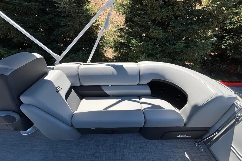 Slide: The Image of 2027 Sun Tracker Party Barge 22 DLX with gray seating and cup holders. - 46