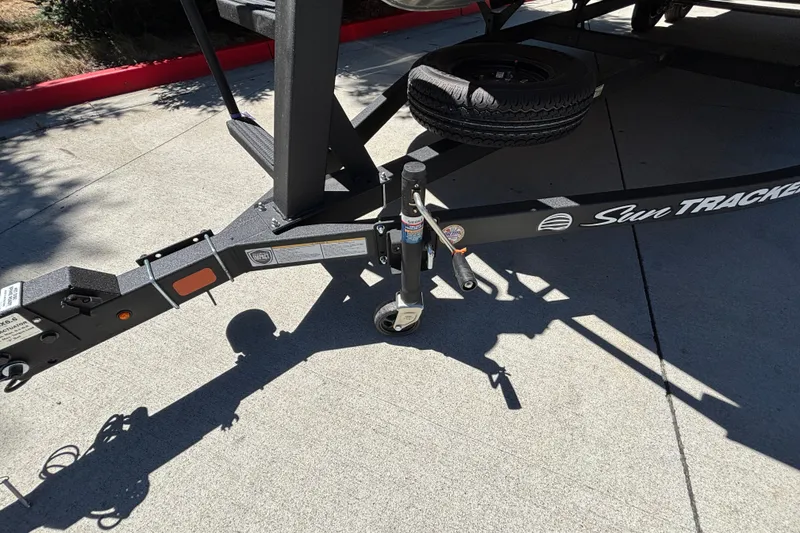 Slide: The Image of Trailer hitch of a 2027 Sun Tracker Party Barge 22 DLX on concrete surface. - 56