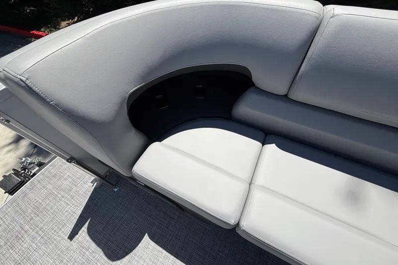 Slide: The Image of Sun Tracker Party Barge 22 DLX 2027, featuring sleek gray seating with integrated cup holders. - 40