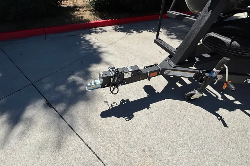 Slide: The Image of Trailer hitch of 2027 Sun Tracker Party Barge 22 DLX on concrete surface. - 54