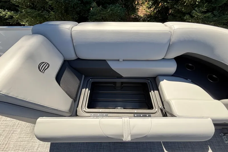 Slide: The Image of Sun Tracker Party Barge 22 DLX 2027, featuring spacious seating and storage compartment. - 22