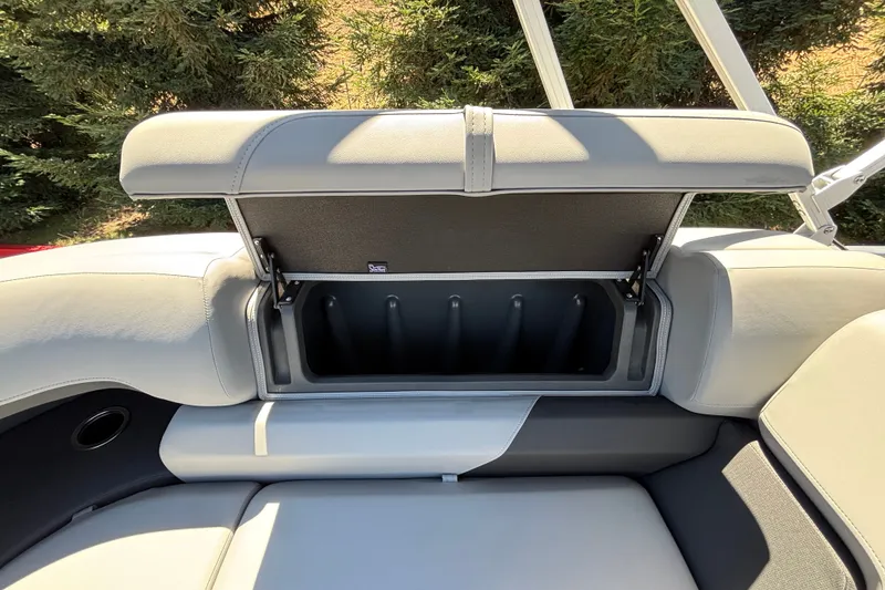 Slide: The Image of Sun Tracker Party Barge 22 DLX 2027, open storage compartment on boat seat. - 31