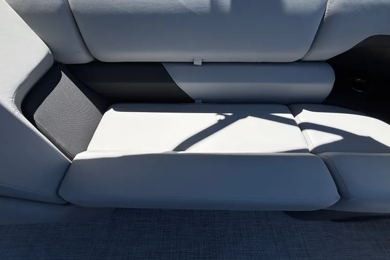 Slide: The Image of 2027 Sun Tracker Party Barge 22 DLX interior seating, featuring sleek gray upholstery. - 33