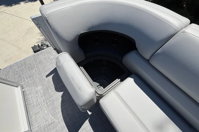Slide: The Image of 2027 Sun Tracker Party Barge 22 DLX seating area with storage compartment. - 43