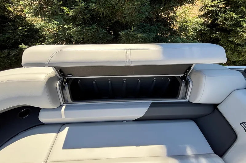 Slide: The Image of Sun Tracker Party Barge 22 DLX 2027 boat seat with open storage compartment. - 26
