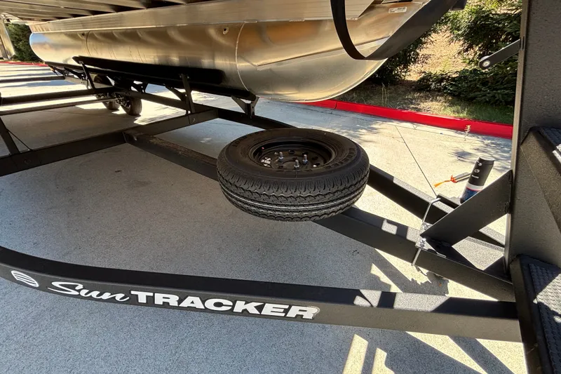 Slide: The Image of Trailer for 2027 Sun Tracker Party Barge 22 DLX with spare tire. - 60
