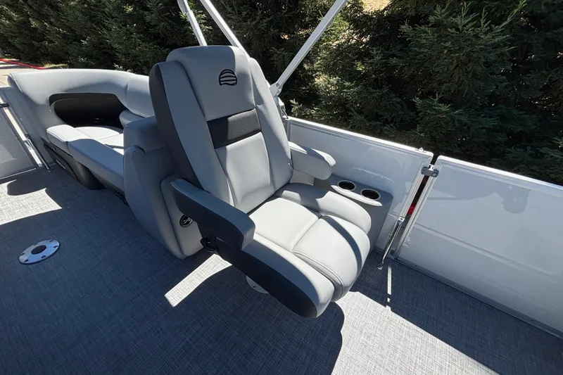 Slide: The Image of Luxurious seating on 2027 Sun Tracker Party Barge 22 DLX pontoon boat, featuring plush gray upholstery. - 47