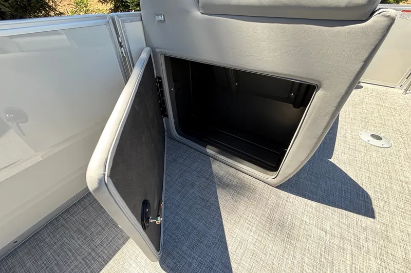 Slide: The Image of Open storage compartment on 2027 Sun Tracker Party Barge 22 DLX pontoon boat. - 52