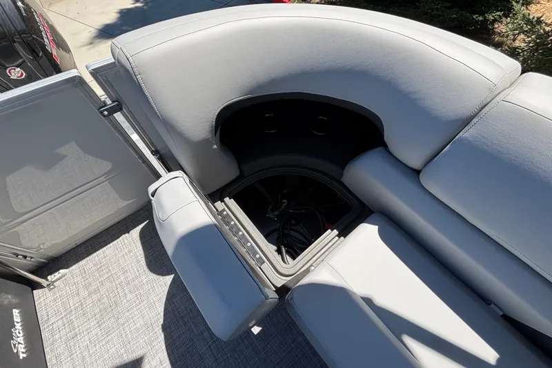 Slide: The Image of Sun Tracker Party Barge 22 DLX 2027, featuring spacious seating and storage compartment. - 23