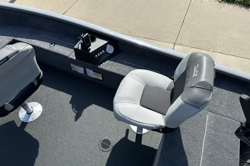 Slide: The Image of 2027 Tracker Super Guide V-16 T boat interior with gray seating and control panel. - 15