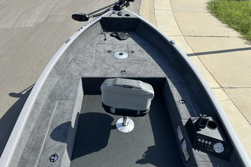 Slide: The Image of 2027 Tracker Super Guide V-16 T fishing boat interior with seating and control panel. - 21