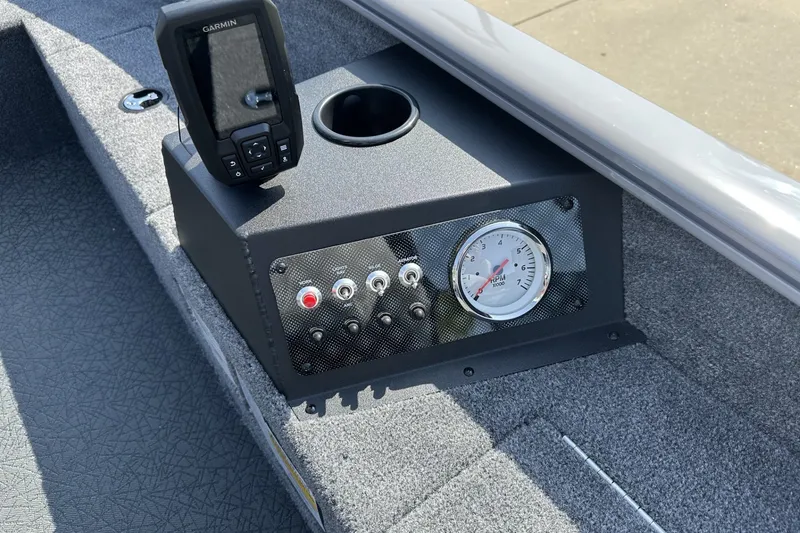 Slide: The Image of Control panel of 2027 Tracker Super Guide V-16 T boat with Garmin device and RPM gauge. - 16