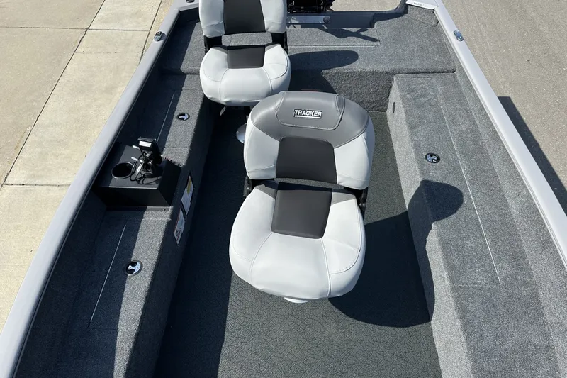 Slide: The Image of 2027 Tracker Super Guide V-16 T boat interior with two cushioned seats and carpeted flooring. - 14