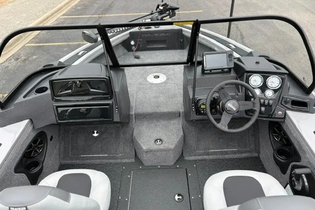 Slide: The Image of 2027 Tracker Targa V-18 WT boat interior with steering wheel, dashboard, and seating. - 21