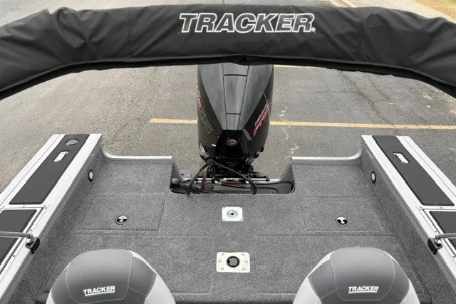 Slide: The Image of 2027 Tracker Targa V-18 WT boat interior with motor and seating. - 20