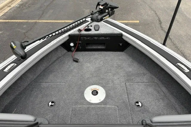 Slide: The Image of 2027 Tracker Targa V-18 WT boat deck with trolling motor and carpeted surface. - 28