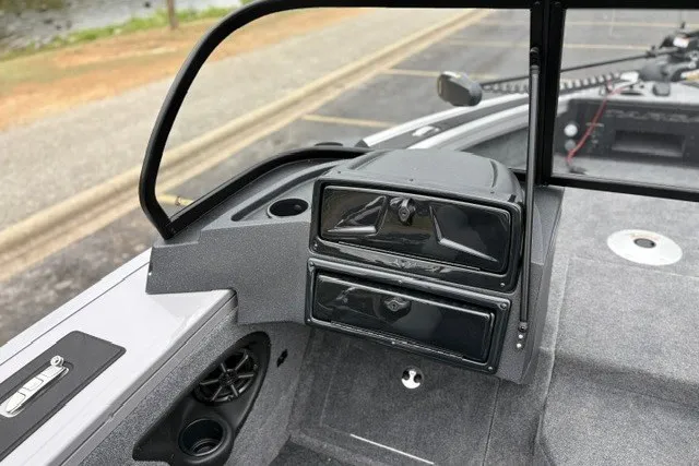 Slide: The Image of 2027 Tracker Targa V-18 WT boat interior with dashboard and speaker details. - 26