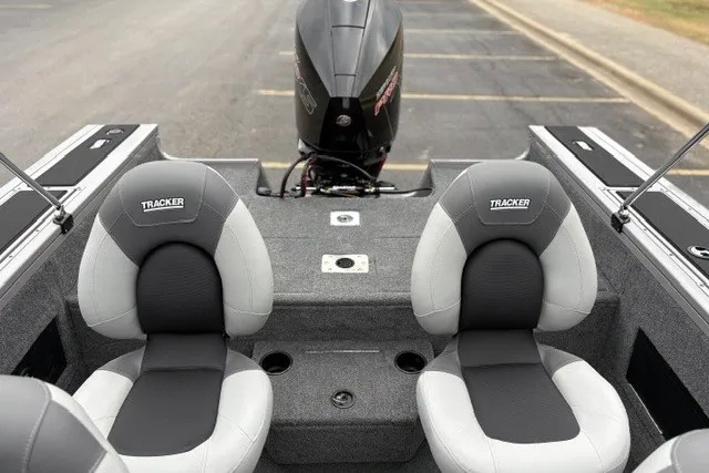 Slide: The Image of 2027 Tracker Targa V-18 WT boat interior with dual seats and motor. - 29