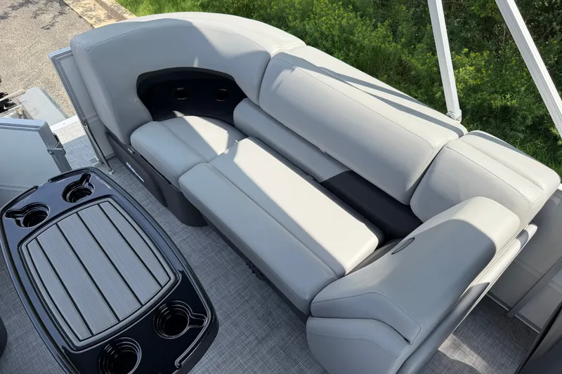Slide: The Image of 2027 Sun Tracker Party Barge 22 DLX with plush seating and sleek table design. - 17