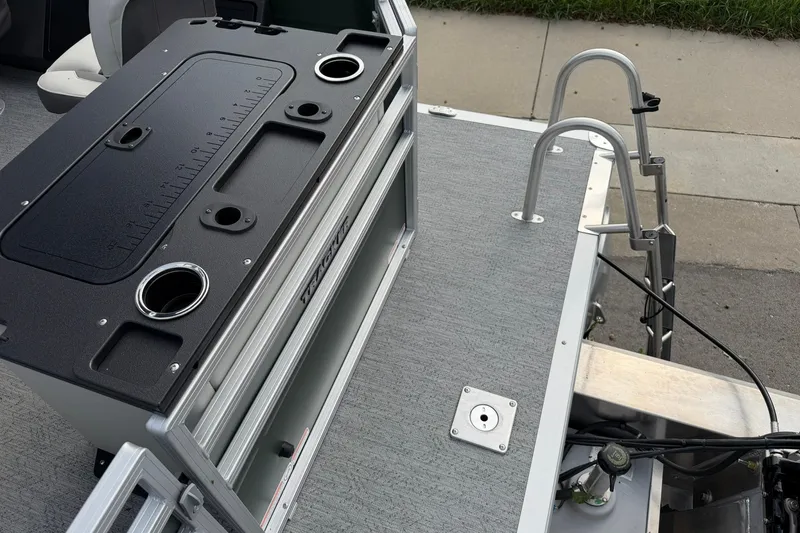 Slide: The Image of 2027 Sun Tracker Fishin' Barge 22 DLX deck with fishing station and ladder. - 26