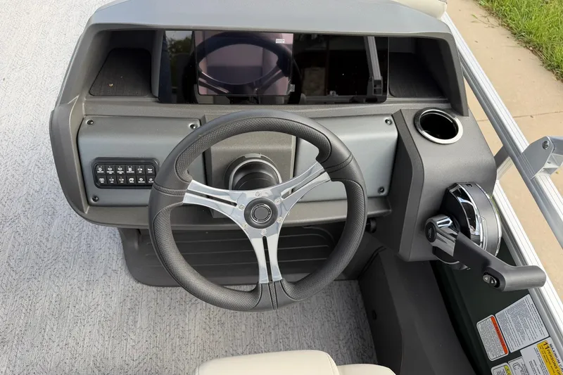 Slide: The Image of Steering console of 2027 Sun Tracker Fishin' Barge 22 DLX with modern controls. - 20