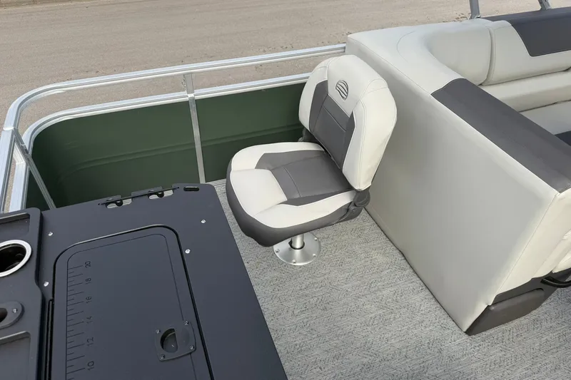 Slide: The Image of 2027 Sun Tracker Fishin' Barge 22 DLX interior with swivel seat and console. - 24