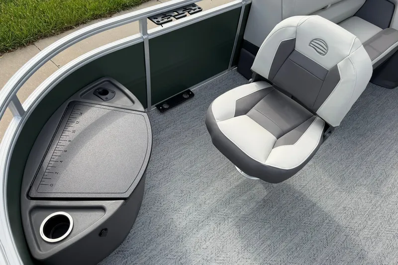 Slide: The Image of 2027 Sun Tracker Fishin' Barge 22 DLX interior with seating and measuring station. - 13