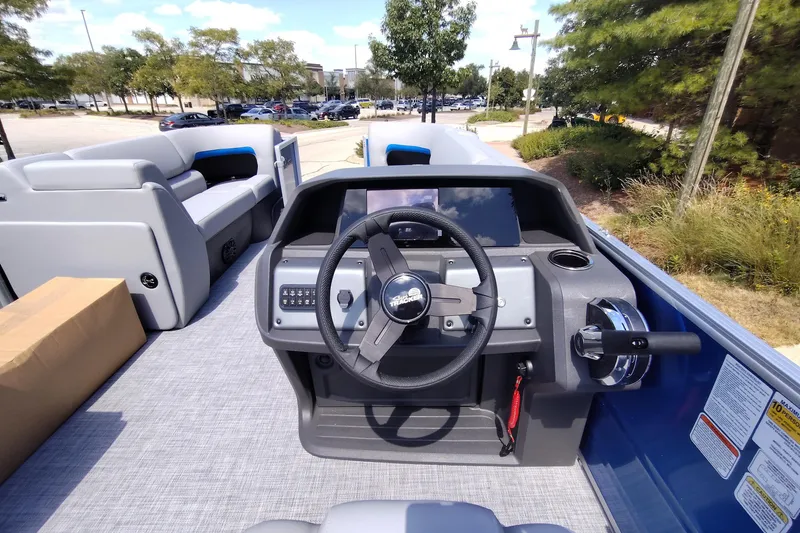 Slide: The Image of 2027 Sun Tracker Party Barge 20 DLX pontoon boat interior with steering console. - 17