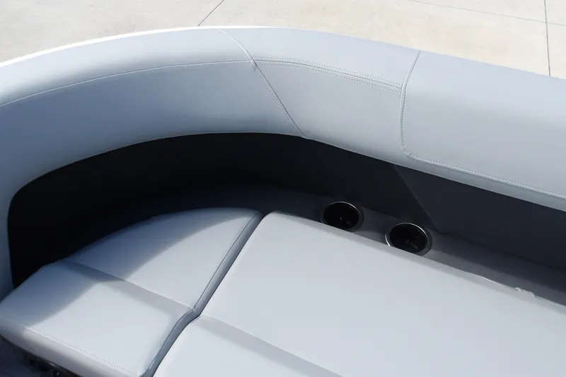 Slide: The Image of Interior seating of 2027 Sun Tracker Party Barge 16 DLX with cup holders. - 19