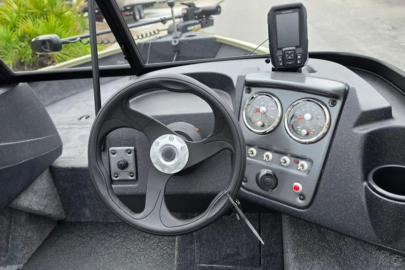 Slide: The Image of Steering console of 2027 Tracker Pro Guide V-16 WT boat with gauges and GPS device. - 13