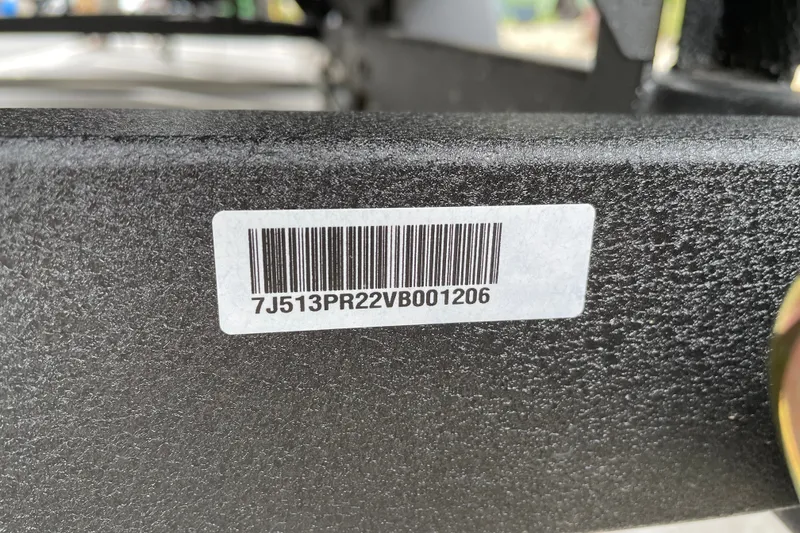 Slide: The Image of Barcode label on 2027 Sun Tracker Party Barge 22 DLX boat trailer. - 119