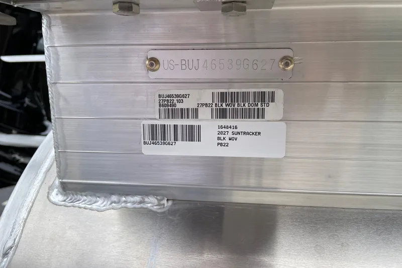 Slide: The Image of 2027 Sun Tracker Party Barge 22 DLX identification plate with serial numbers and labels. - 117
