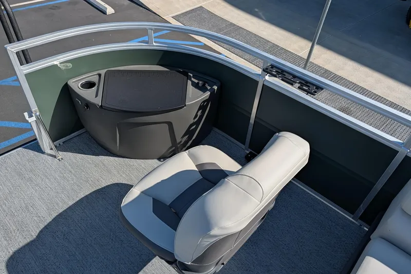 Slide: The Image of 2027 Sun Tracker Fishin' Barge 22 DLX interior with seating and storage area. - 13