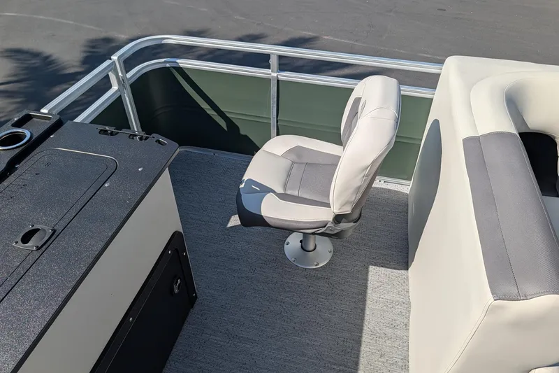 Slide: The Image of 2027 Sun Tracker Fishin' Barge 22 DLX interior with seating and console. - 14