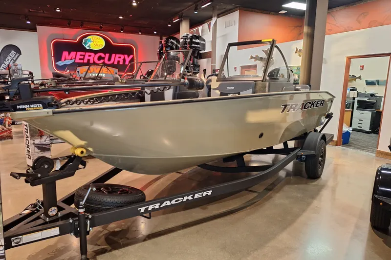 The Image of 2027 Tracker Pro Guide V-175 Combo boat displayed indoors on a trailer. - 0
