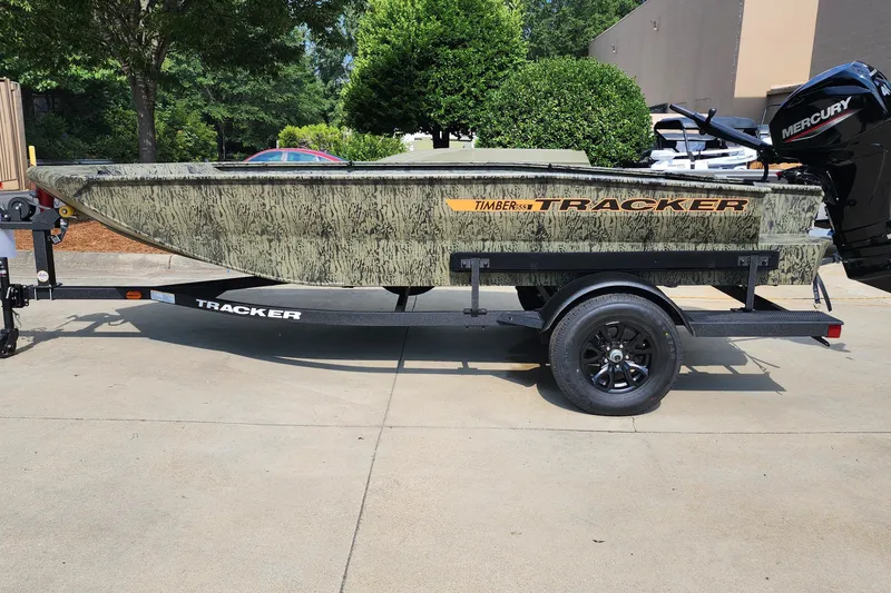 The Image of 2027 Tracker Grizzly 1553 Timber boat on trailer, outdoors. - 0